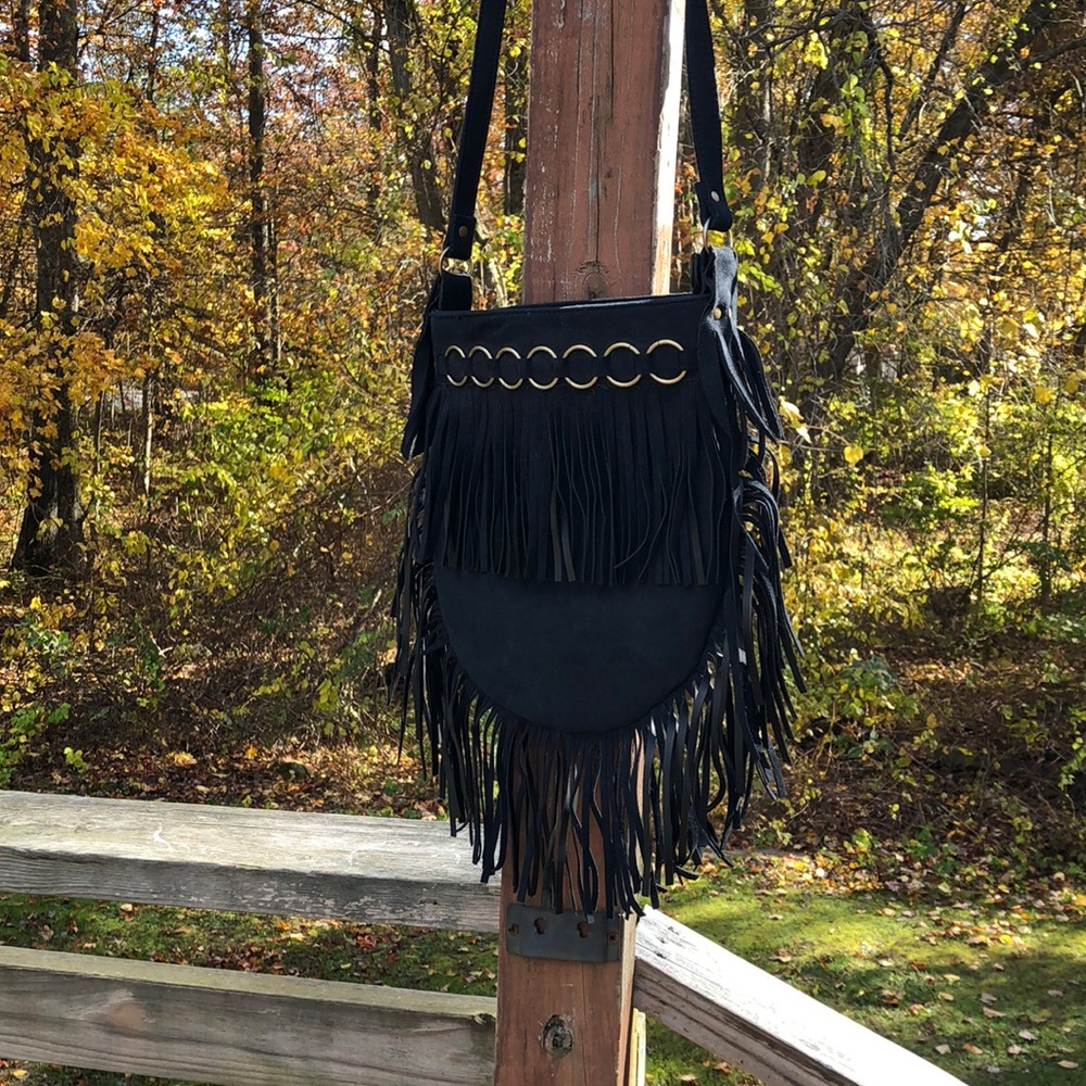 NWOT Black suede fringed bag with brass hardware.